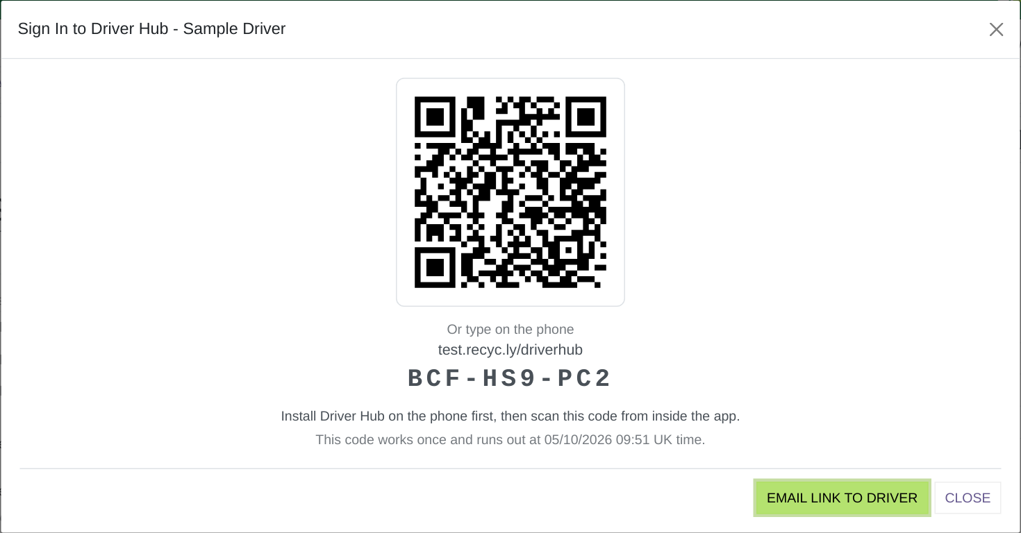 The Sign In to Driver Hub pop-up, with the QR code and the code typed out.